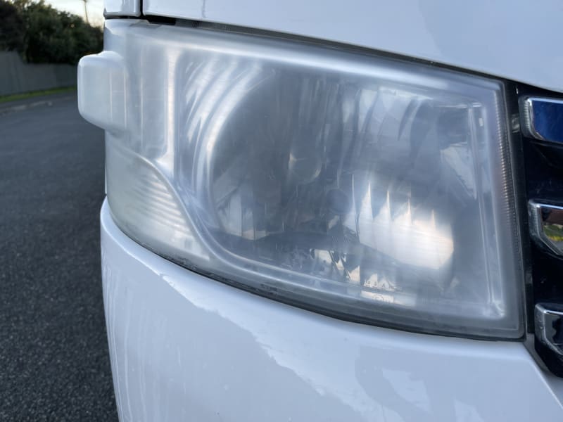 The left hand main light of a vehicle, visually cloudy