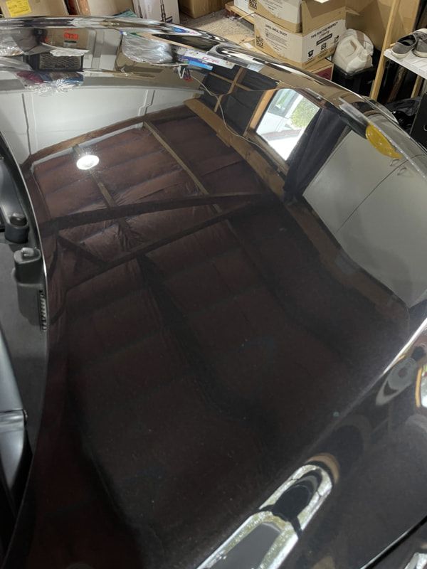 Completed ceramic coating application on Mazda showing gloss and paint protection result