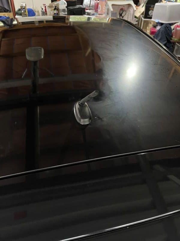 Restored Mazda roof after detailing, showing a deep gloss finish