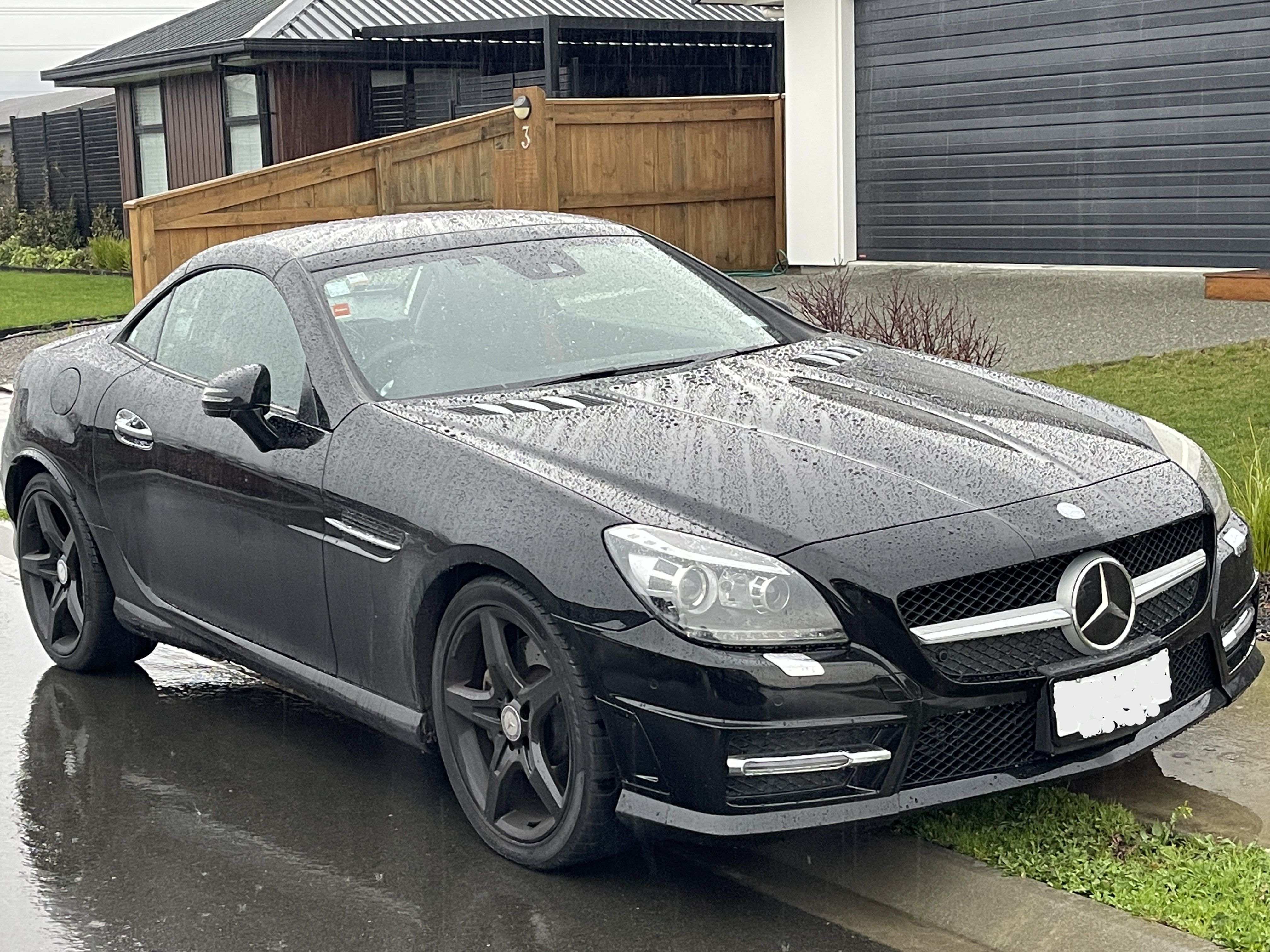Mercedes vehicle in Nelson rain showing water beading from ceramic coating protection