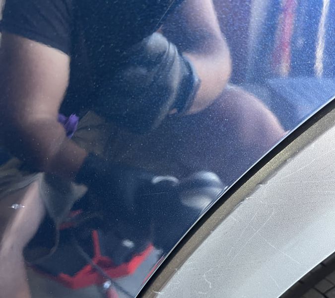 Vehicle paint after professional correction showing mirror-like finish