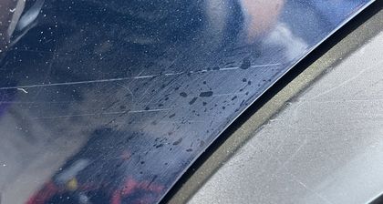 Paintwork showing swirl marks and light scratching under inspection lighting