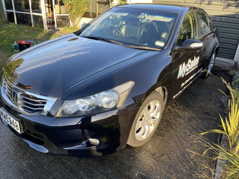 Sedan with ceramic coated paintwork showing even gloss across the bonnet and roof