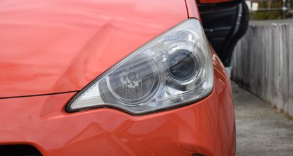 Restored headlight lens showing clear optics after polishing