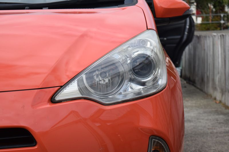 Restored headlight lens showing clear optics after polishing