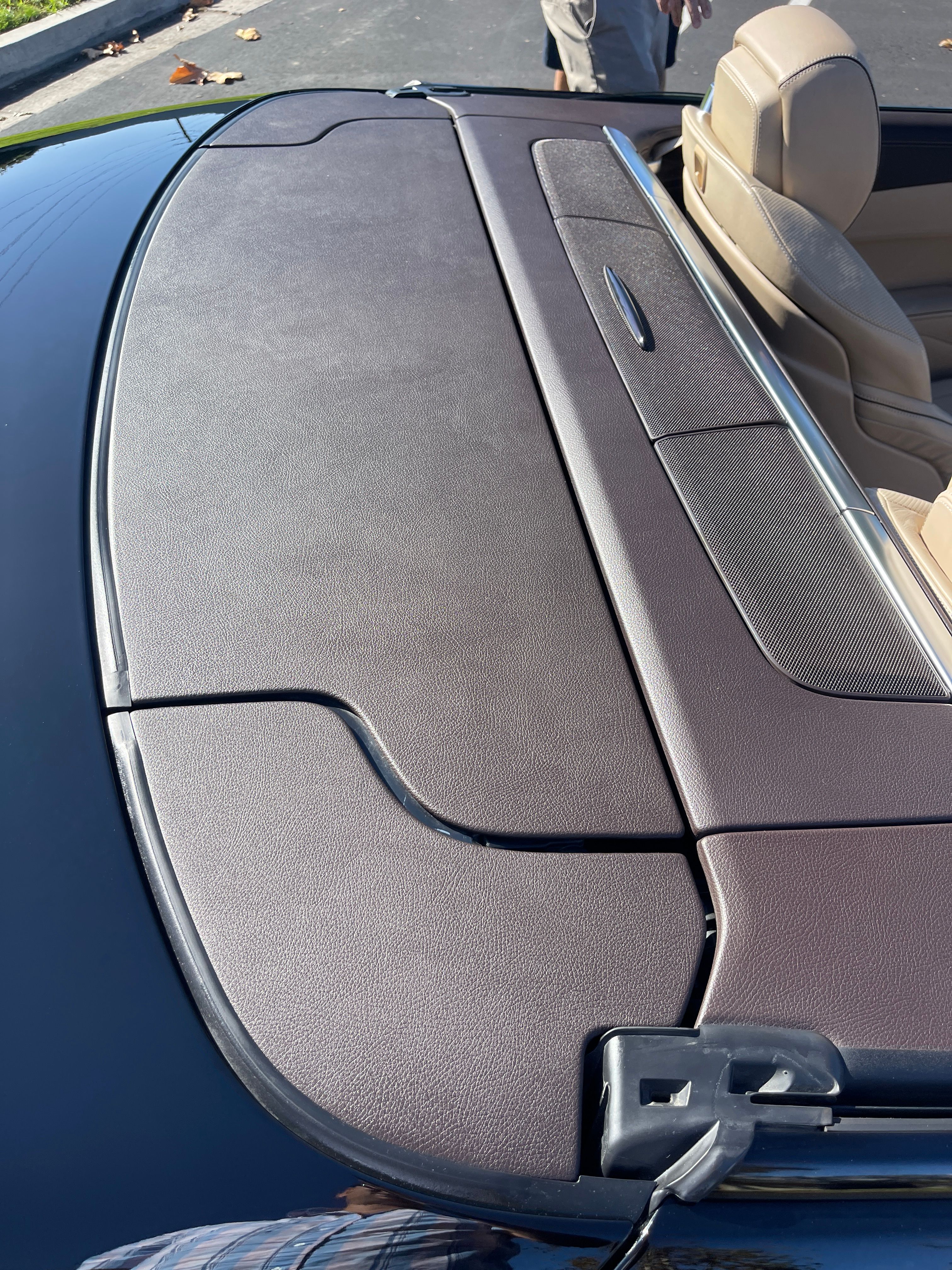 Restored Mercedes SL550 interior plastic trim showing renewed original color and texture after professional restoration