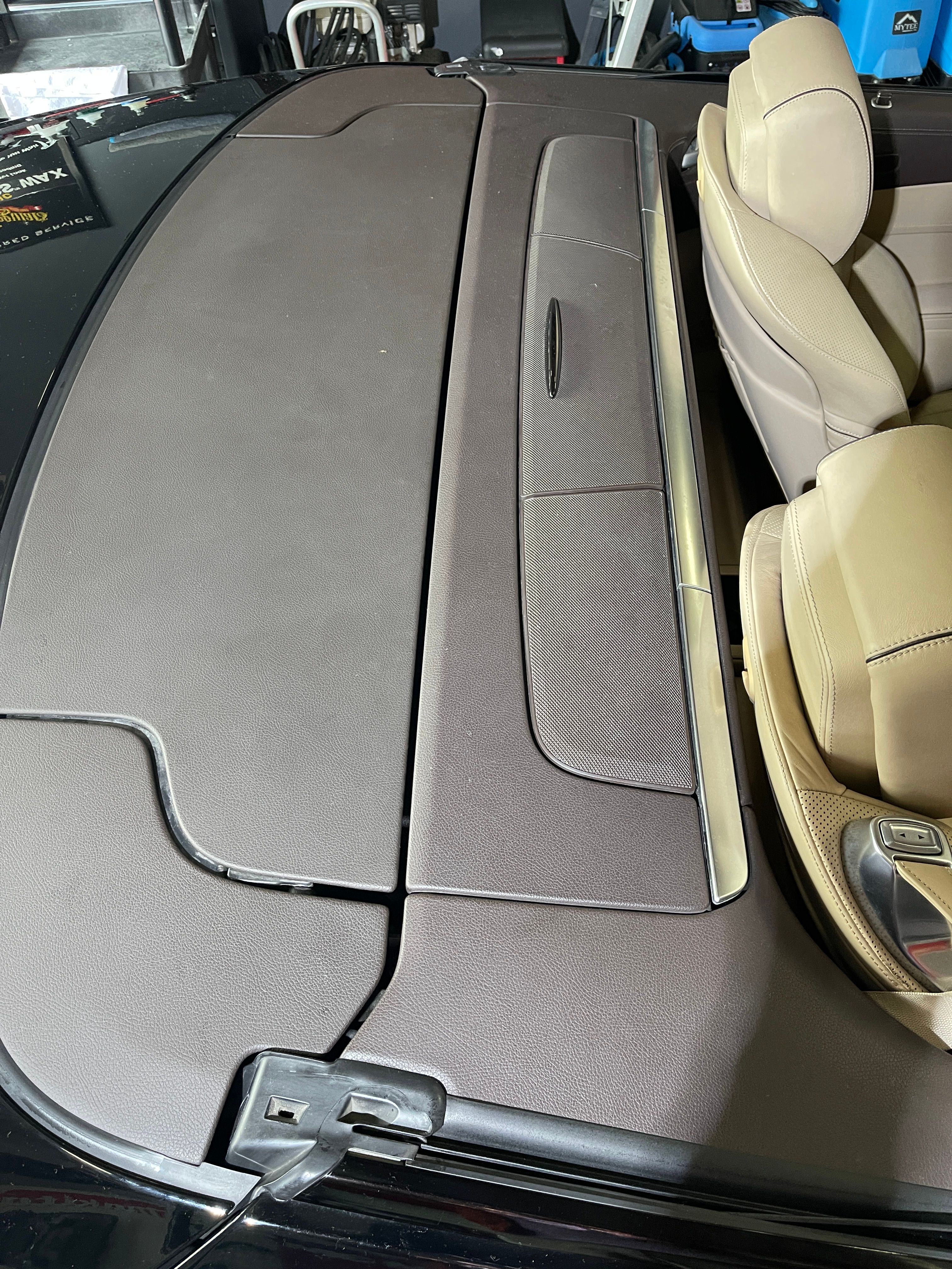 Faded and neglected plastic trim in Mercedes SL550 interior showing sun damage and wear before restoration