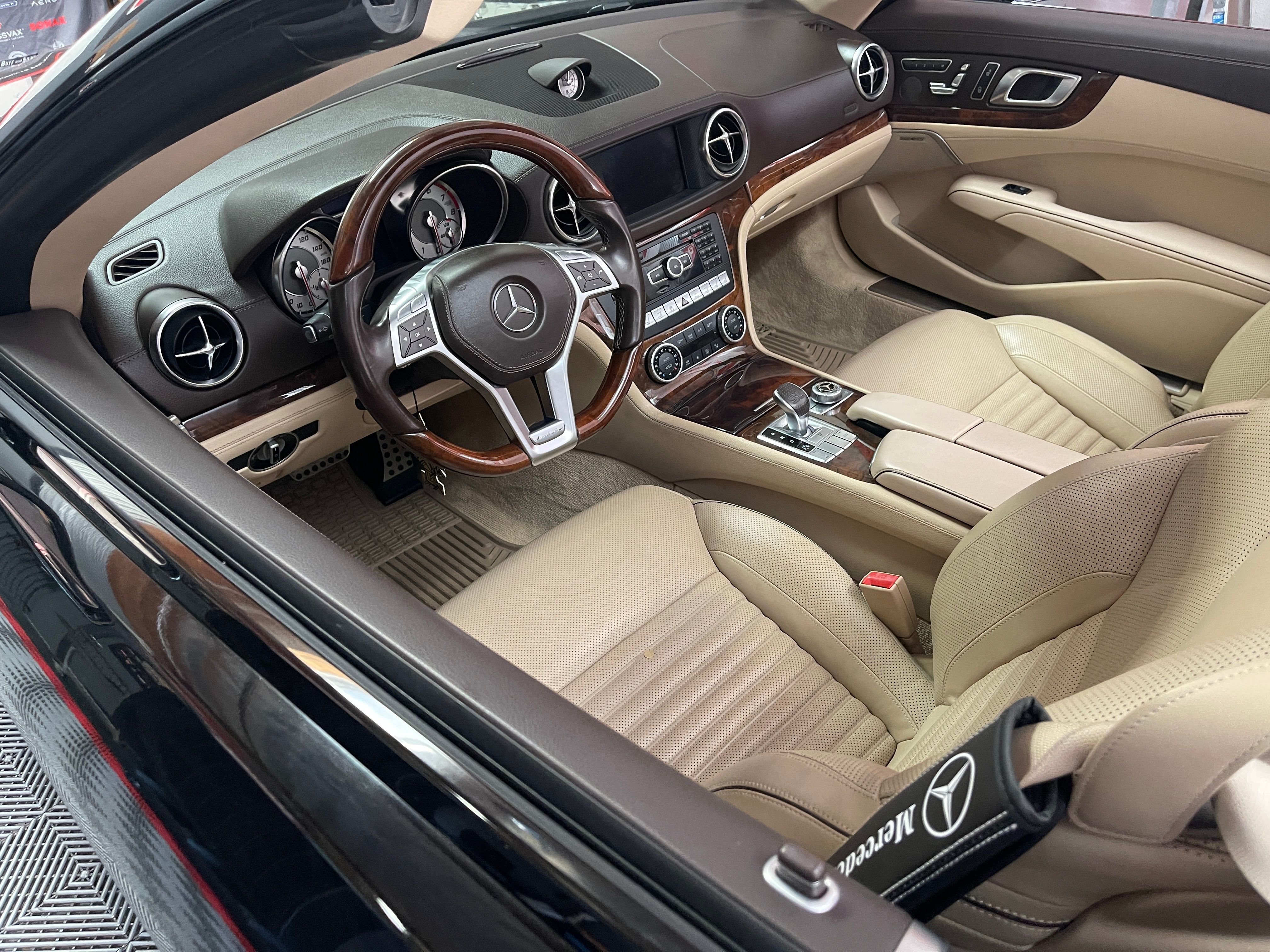 Pristine Mercedes SL550 interior after complete restoration showing clean leather seats, renewed trim, and showroom condition