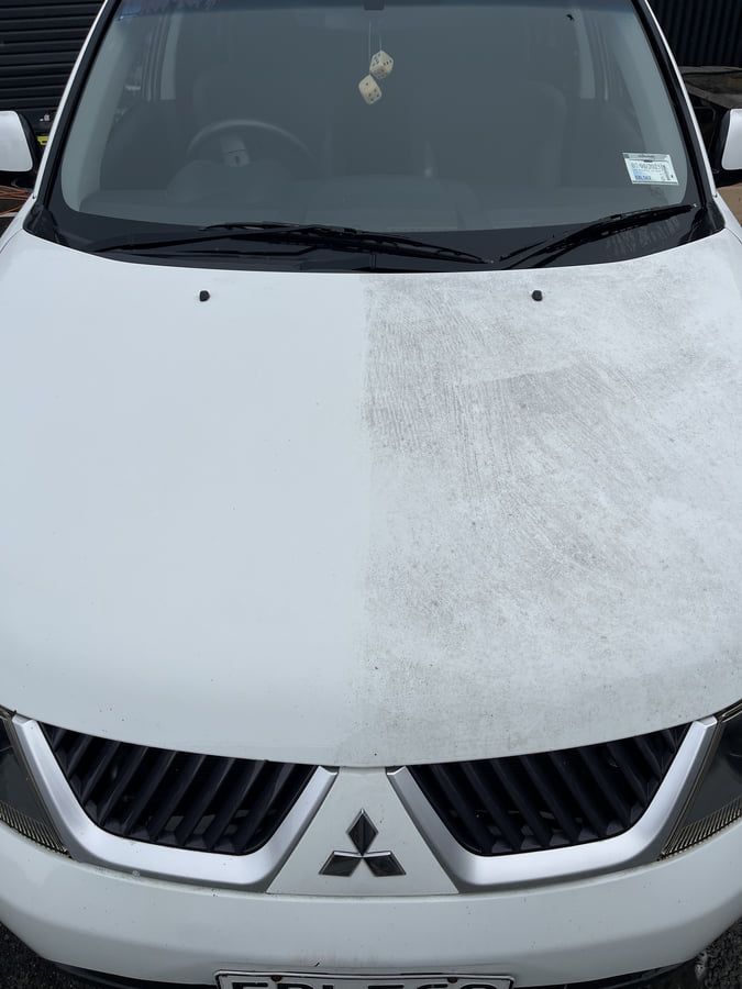 Vehicle showing contamination differences - clean bonnet on left versus industrial fallout buildup on right
