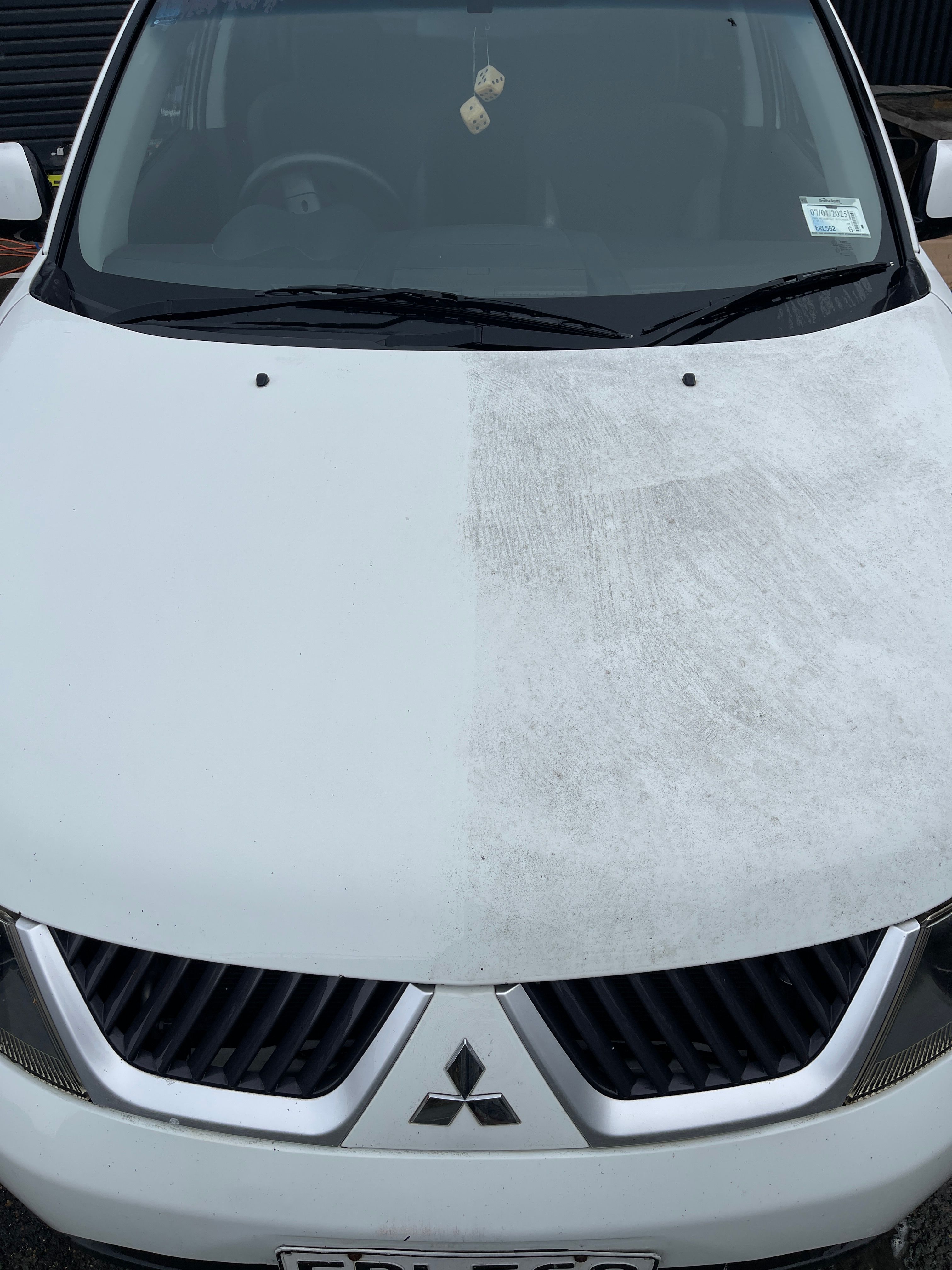 Vehicle showing contamination differences - clean bonnet on left versus industrial fallout buildup on right
