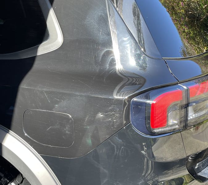 Paint surface showing swirl marks and scratches before correction