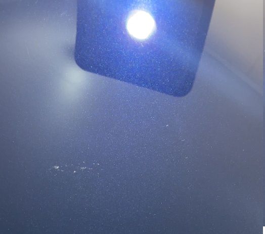 Same paintwork after machine polishing, with even reflection and no visible swirling