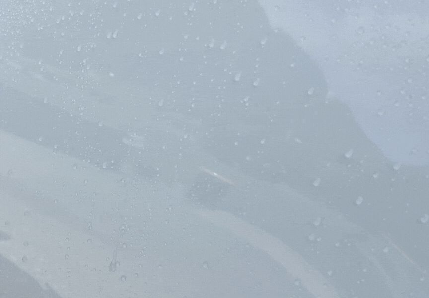 Tight water beading on a ceramic coated panel showing the coating still performing