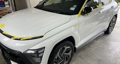 Ceramic coated white vehicle showing depth and reflection across the bonnet